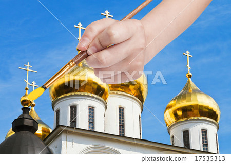 painbrush paints golden cupola on russian church 17535313