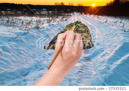 sunset under snowcovered country road 17535321