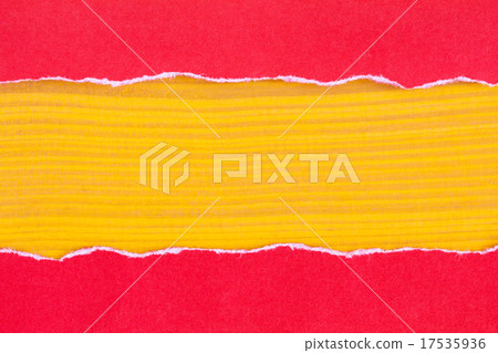 Torn red paper with a yellow wooden background Torn red paper with a yellow wooden background 17535936