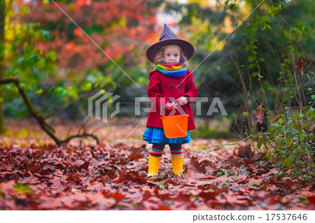 Little girl in witch costume at Halloween 17537646