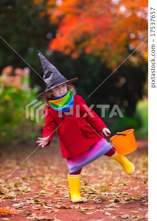 Little girl in witch costume at Halloween 17537657