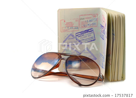 Journal, passport and sunglasses on white. 17537817