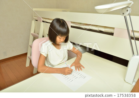 Elementary school girl studying in a children's room 17538358