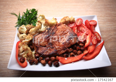 grilled meat cooked with nuts and vegetables serving grilled meat cooked with nuts and vegetables serving 17542167