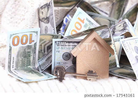 wooden toy house - the concept of housing purchase mortgage dollars cash money wooden toy house - the concept of housing purchase mortgage dollars cash money 17543161