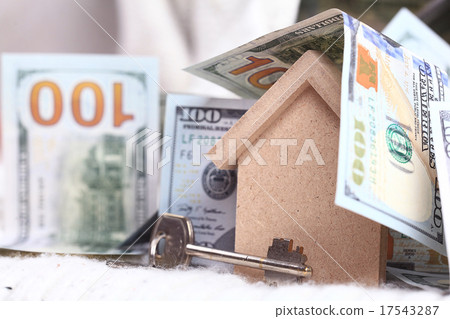 wooden toy house - the concept of housing purchase mortgage dollars cash money wooden toy house - the concept of housing purchase mortgage dollars cash money 17543287