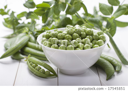 Fresh green peas in a white bowl Fresh green peas in a white bowl 17545851