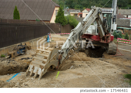 excavator ploughshare on trench - constructing 17546481