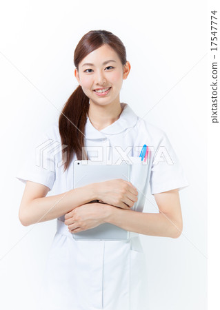 A nurse holding an iPad A nurse holding an iPad 17547774
