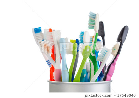 Group of old and used toothbrush in metal cup Group of old and used toothbrush in metal cup 17549046