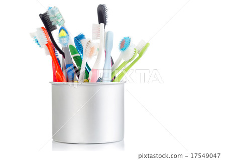 Group of old and used toothbrush in metal cup Group of old and used toothbrush in metal cup 17549047