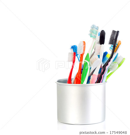 Group of old and used toothbrush in metal cup Group of old and used toothbrush in metal cup 17549048