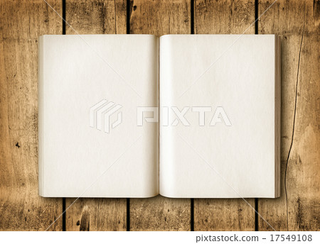Open book on a brown wood table Open book on a brown wood table 17549108