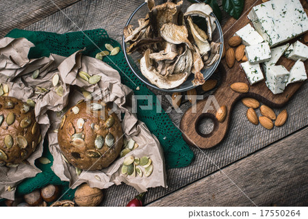 Autumn harvest nuts mushrooms cheese bread buns 17550264