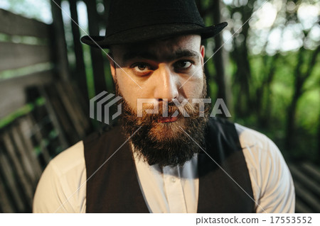 man in a hangar with subdued light 17553552