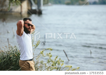 American Bearded Man touching his beard American Bearded Man touching his beard 17553553