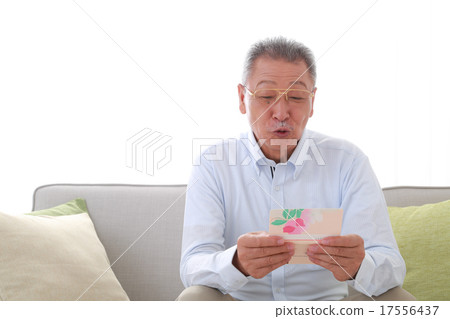 Senior men happy to see bank passbook 17556437