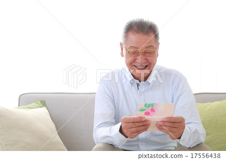Senior men happy to see bank passbook 17556438