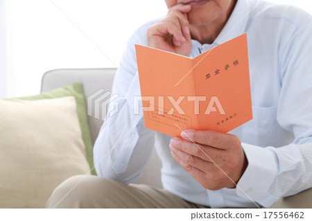 Senior men watching the pension book 17556462
