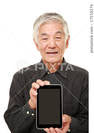 Elderly people showing tablets Elderly people showing tablets 17559274