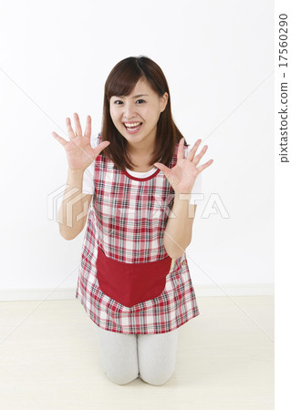 A woman holding both hands 17560290