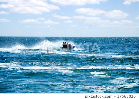 High speed jet ski at sea High speed jet ski at sea 17563026