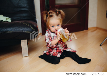 Sweet baby girl sitting on the floor 17567138