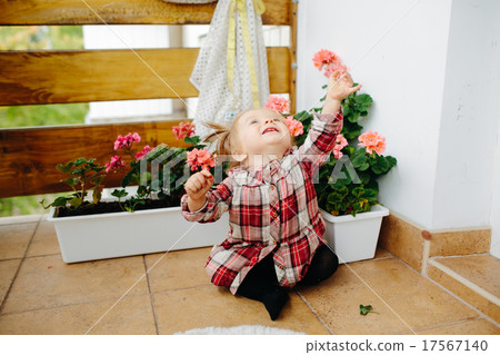 Little girl playing on the balcony 17567140