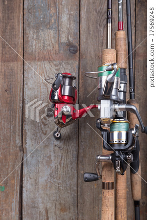 fishing tackles on old wooden board fishing tackles on old wooden board 17569248