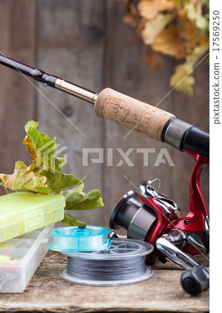fishing tackles on old wooden board fishing tackles on old wooden board 17569250