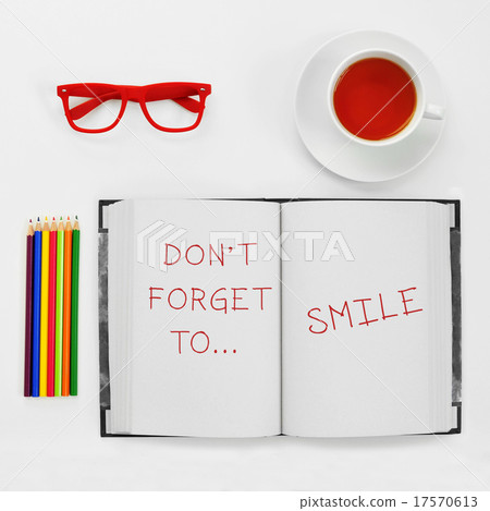 text dont forget to smile written in a notepad 17570613