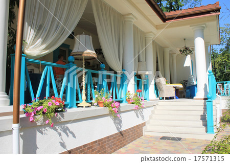 Beautiful terrace with bright colored furniture Beautiful terrace with bright colored furniture 17571315