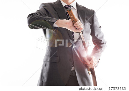 A businessman holding a Japanese sword 17572583