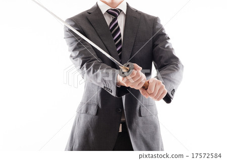 A businessman holding a Japanese sword 17572584