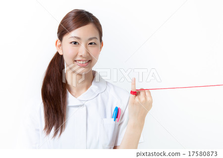 A nurse who tied a red thread to a little finger A nurse who tied a red thread to a little finger 17580873