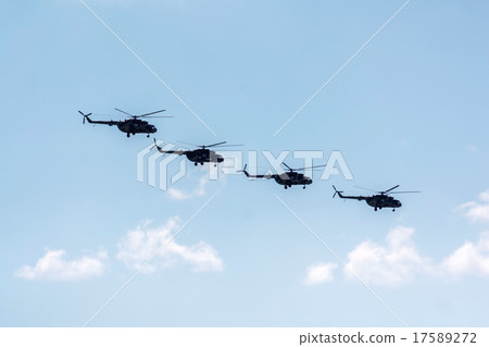 Helicopters flying against the blue sky 17589272