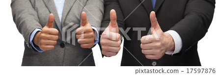 businessman and businesswoman showing thumbs up businessman and businesswoman showing thumbs up 17597876