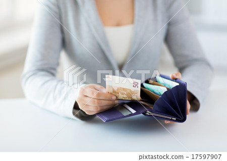 close up of woman hands with wallet and euro money close up of woman hands with wallet and euro money 17597907