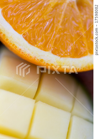 close up of fresh juicy orange and mango slices 17598082