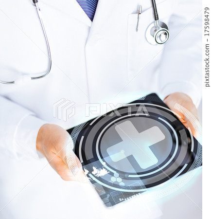 male doctor holding tablet pc with medical app 17598479