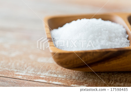close up of white salt heap in wooden bowl close up of white salt heap in wooden bowl 17598485