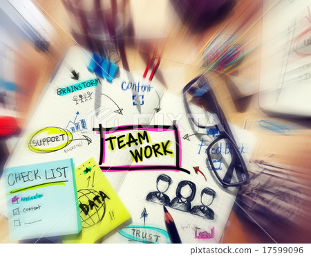 Desk with Tools and a Notebook with Ideas About Teamwork 17599096