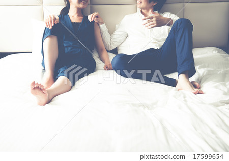 A good couple on the bed 17599654