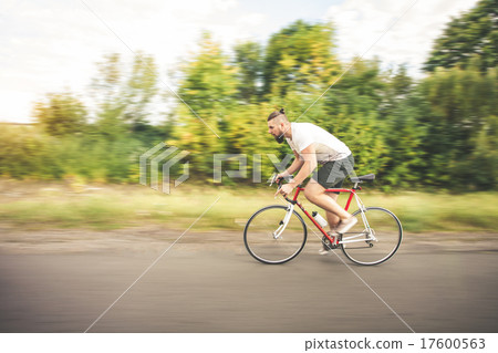 Young bearded hipster driving bicycle 17600563