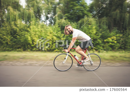 Young hipster man driving fast bicycle 17600564