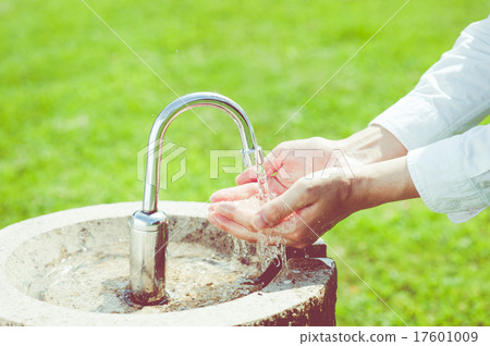 Hand washing in the park's water supply Hand washing in the park's water supply 17601009