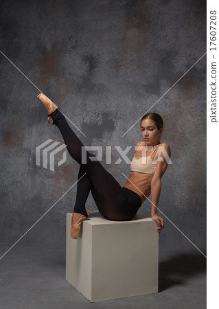 Young beautiful modern style dancer posing on a Young beautiful modern style dancer posing on a 17607208