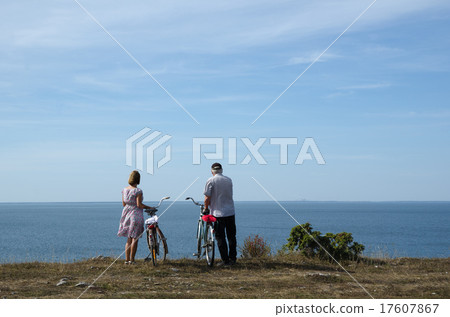 Couple with bikes at the coast 17607867