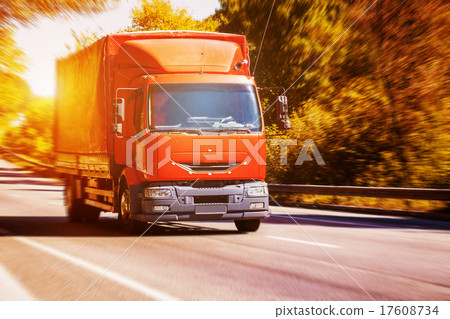 Red truck on blurry asphalt road Red truck on blurry asphalt road 17608734