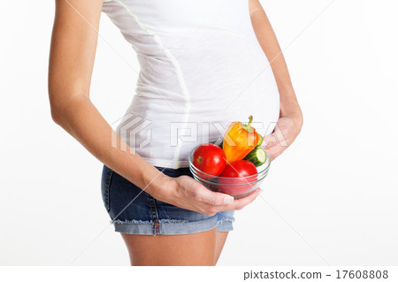 Belly of pregnant girl with vegetables Belly of pregnant girl with vegetables 17608808